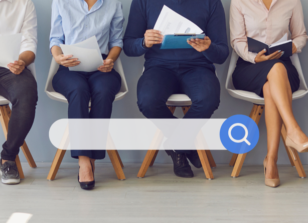 Candidates sitting in a line waiting to be interviewed; search field with magnifying glass sitting over image